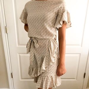 cream patterned/ruffled dress